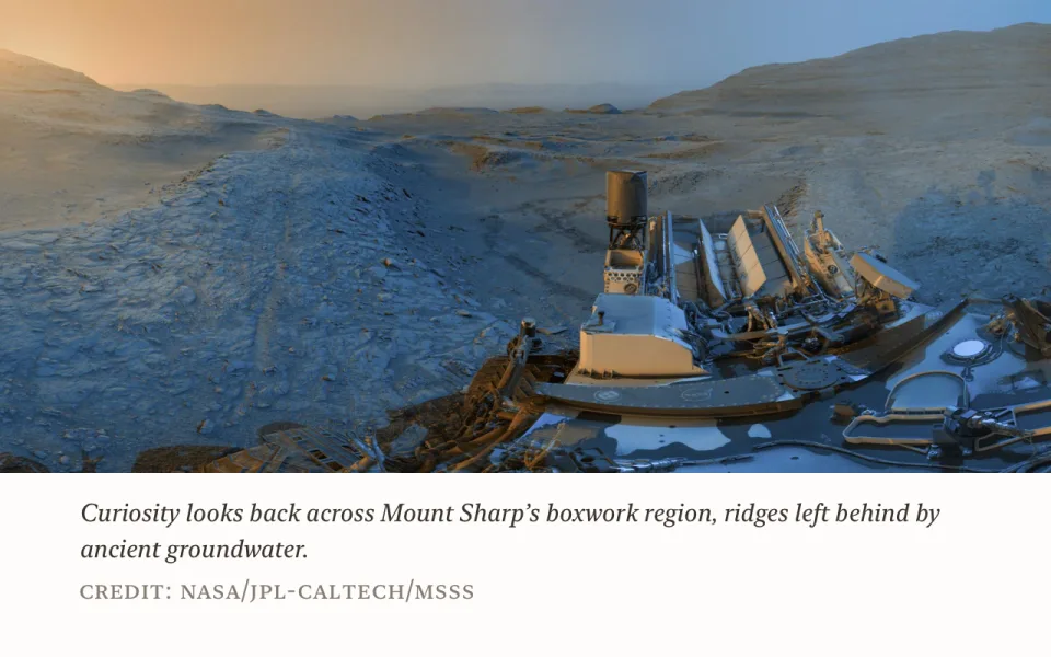 A photo with its caption in serif italic and a credit line in small caps beneath it.